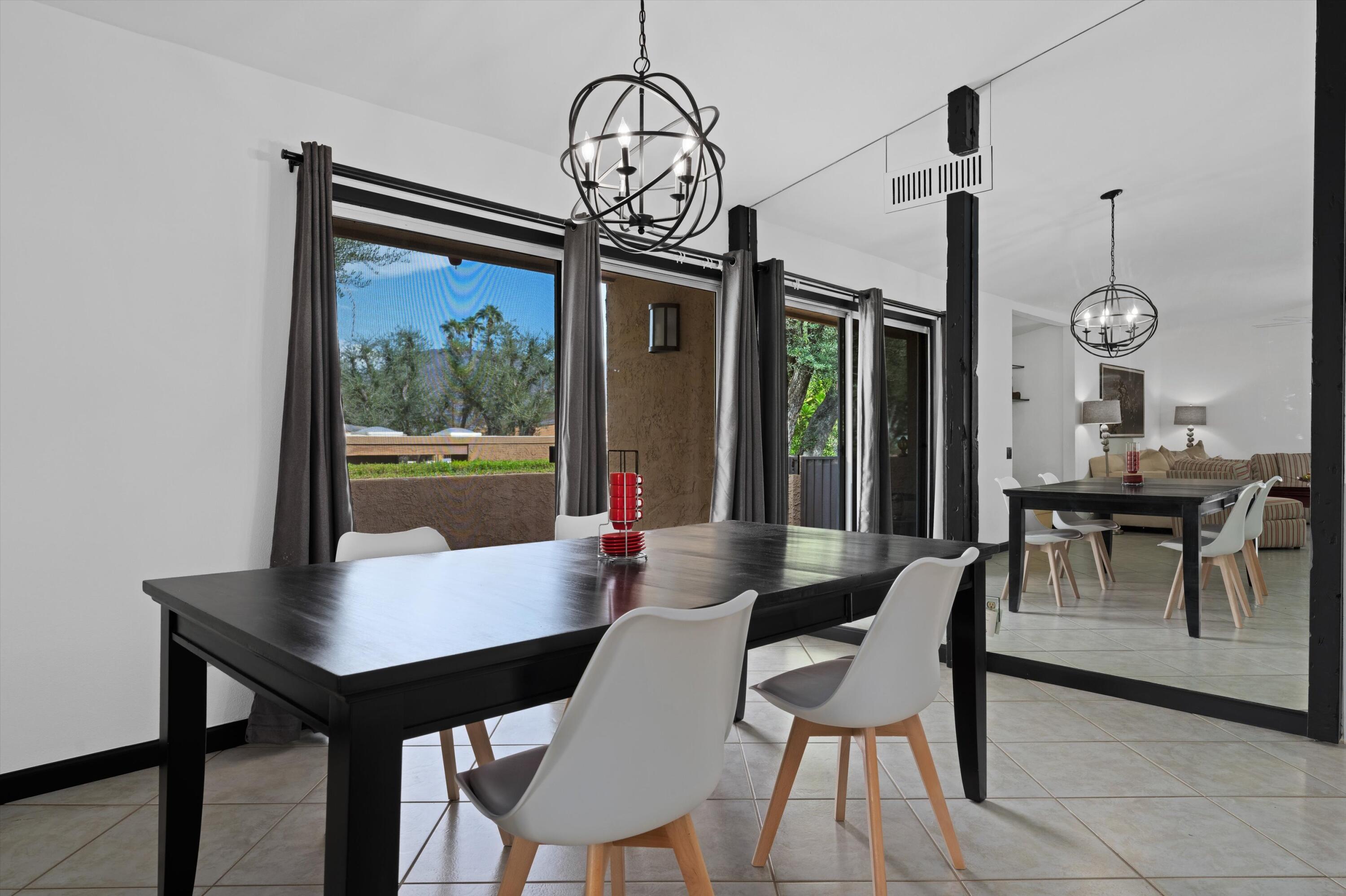 73476 Dalea Lane Palm Desert, CA 92260 - Photo 34 of 37 a view of a dining room with furniture window and wooden floor