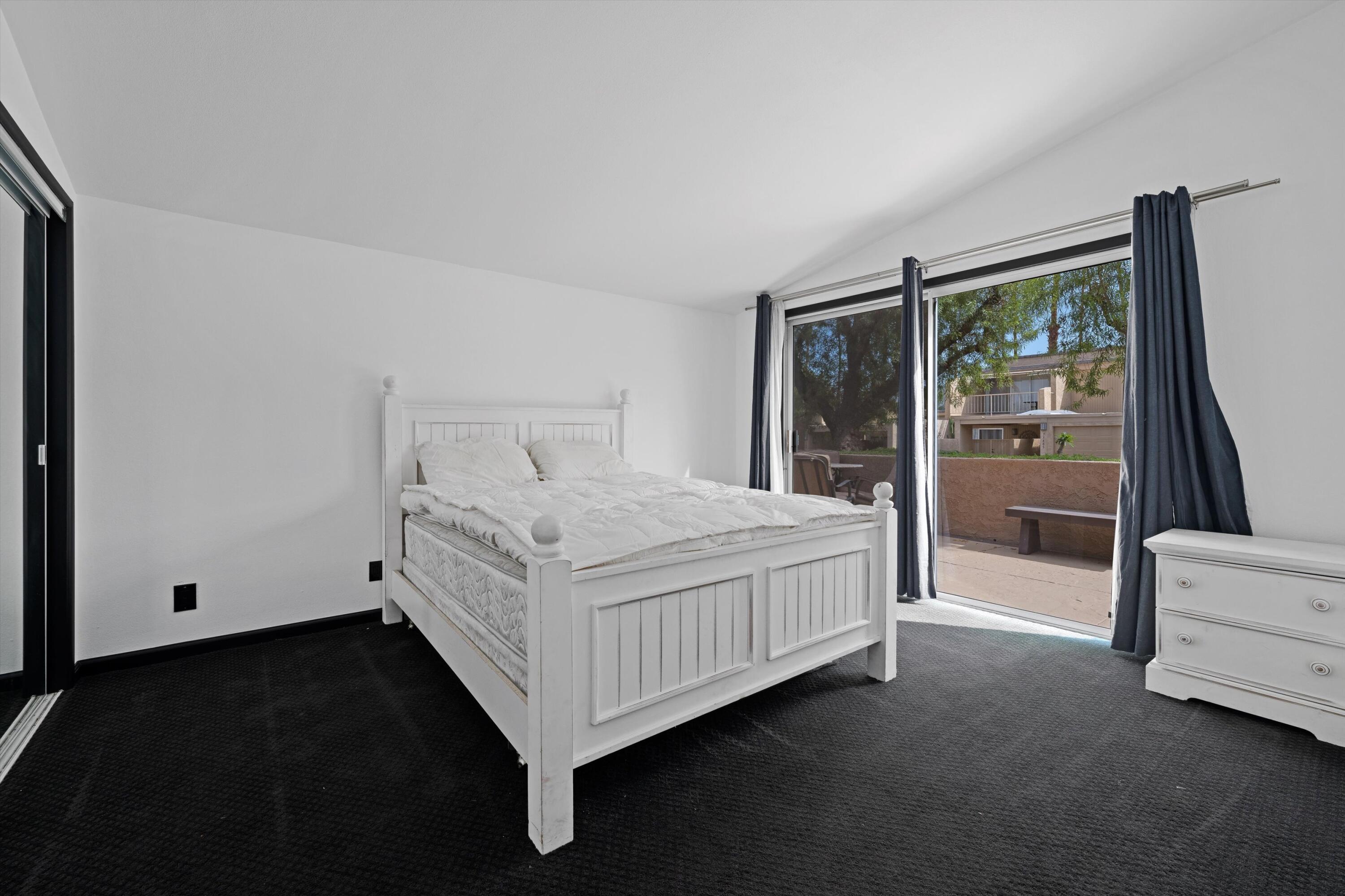 73476 Dalea Lane Palm Desert, CA 92260 - Photo 35 of 37 a bed sitting in a room next to a window