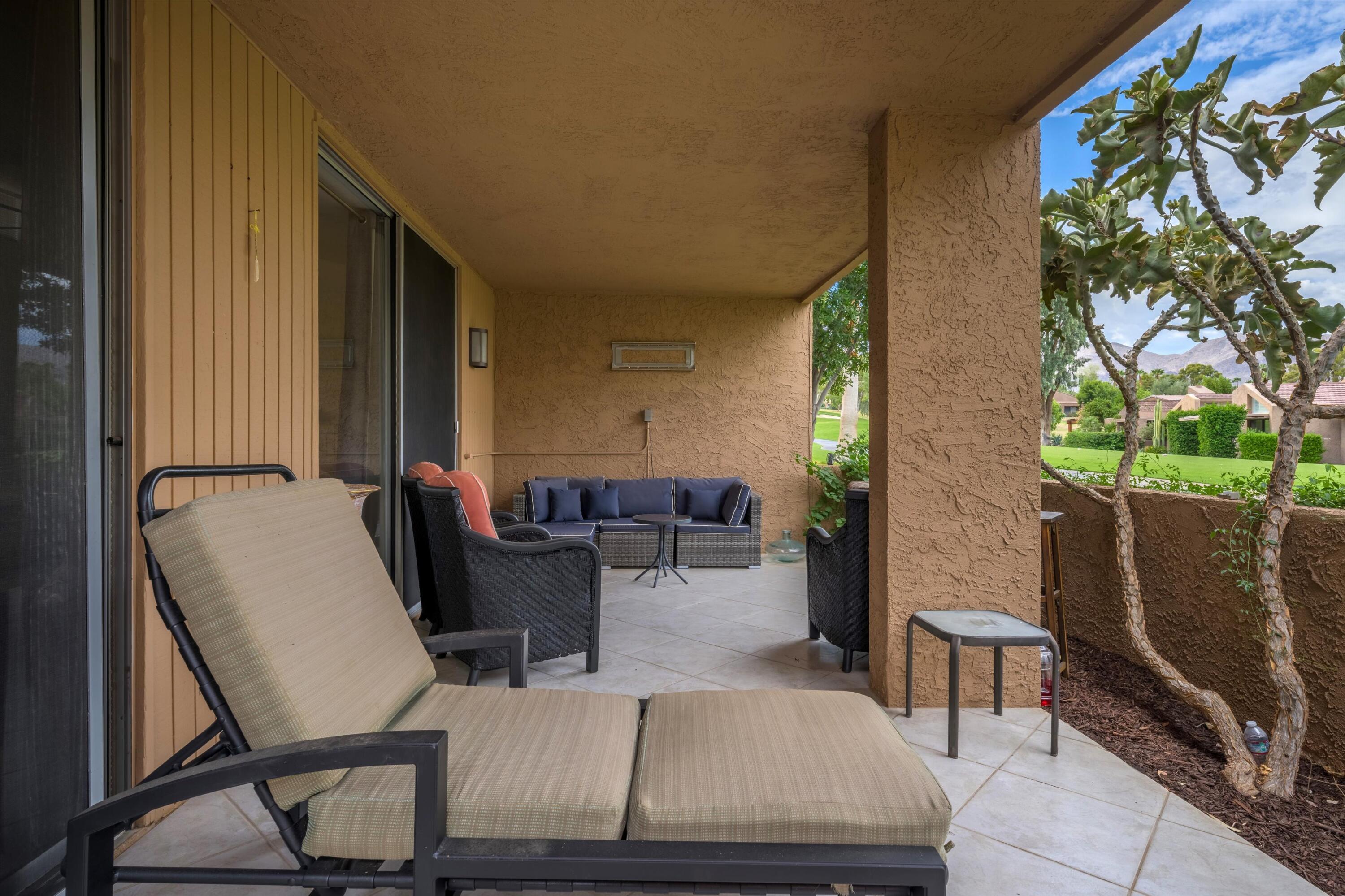 73476 Dalea Lane Palm Desert, CA 92260 - Photo 5 of 37 a living room with furniture and a flat screen tv
