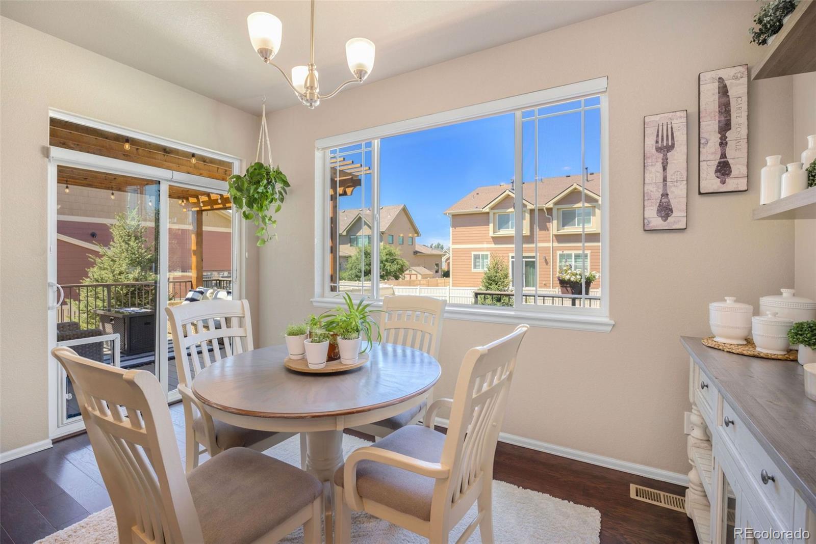 8809 Foxfire Street Firestone, CO 80504 - Photo 12 of 32 a view of a dining room with furniture window and outside view