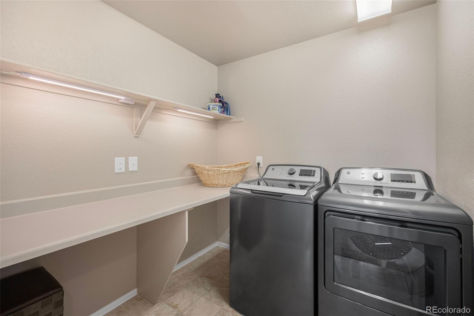 8809 Foxfire Street Firestone, CO 80504 - Photo 17 of 32 a utility room with dryer and washer