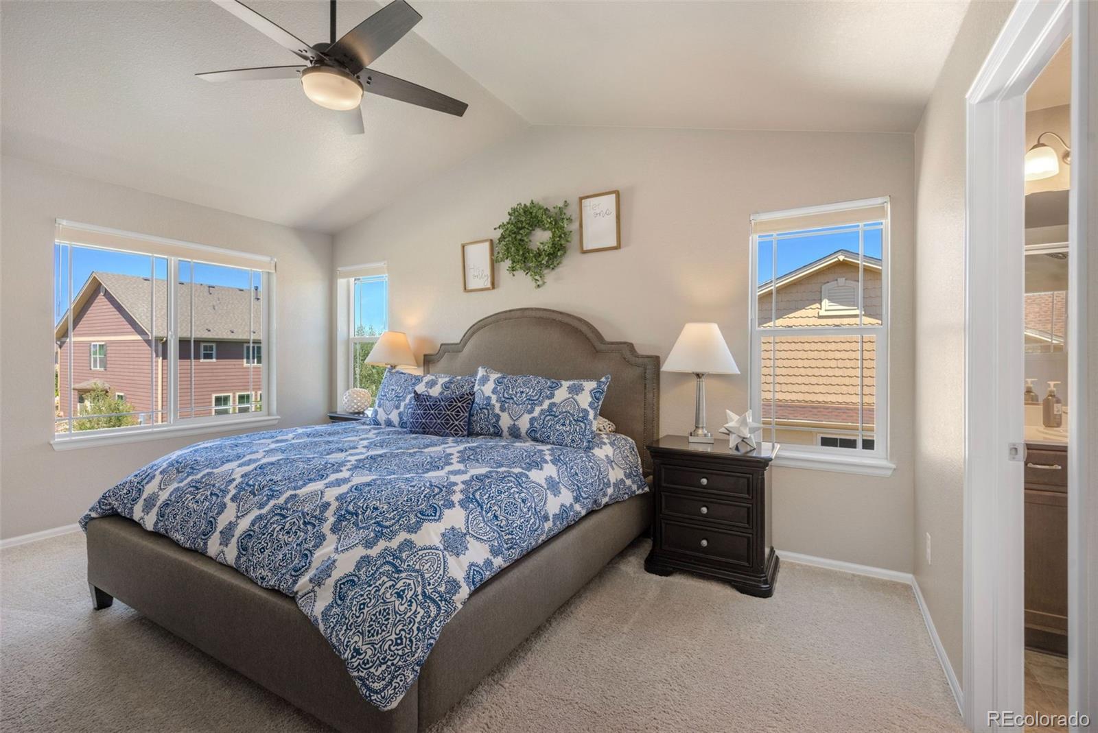 8809 Foxfire Street Firestone, CO 80504 - Photo 18 of 32 a bedroom with a bed and window