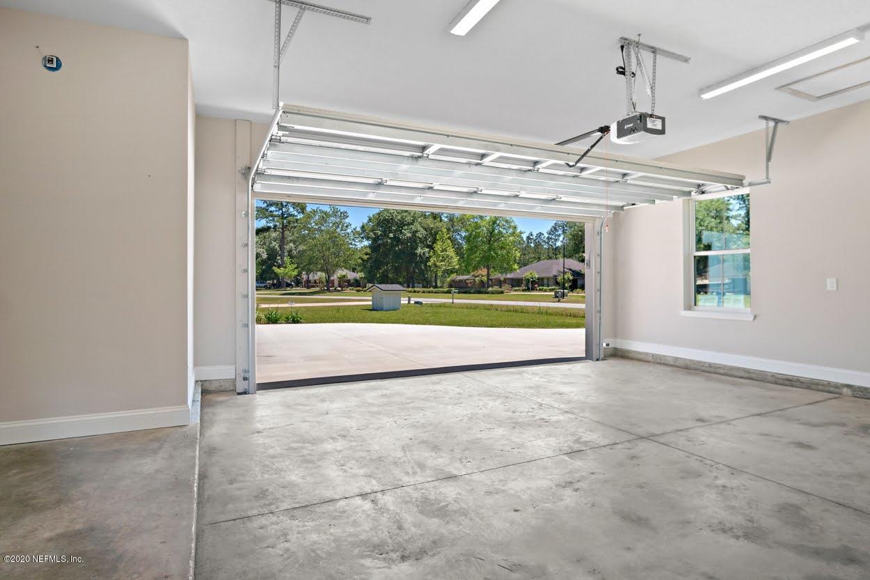 55107 Deer Run Road Callahan, FL 32011 - Photo 42 of 43 a view of a big room with wooden floor and windows