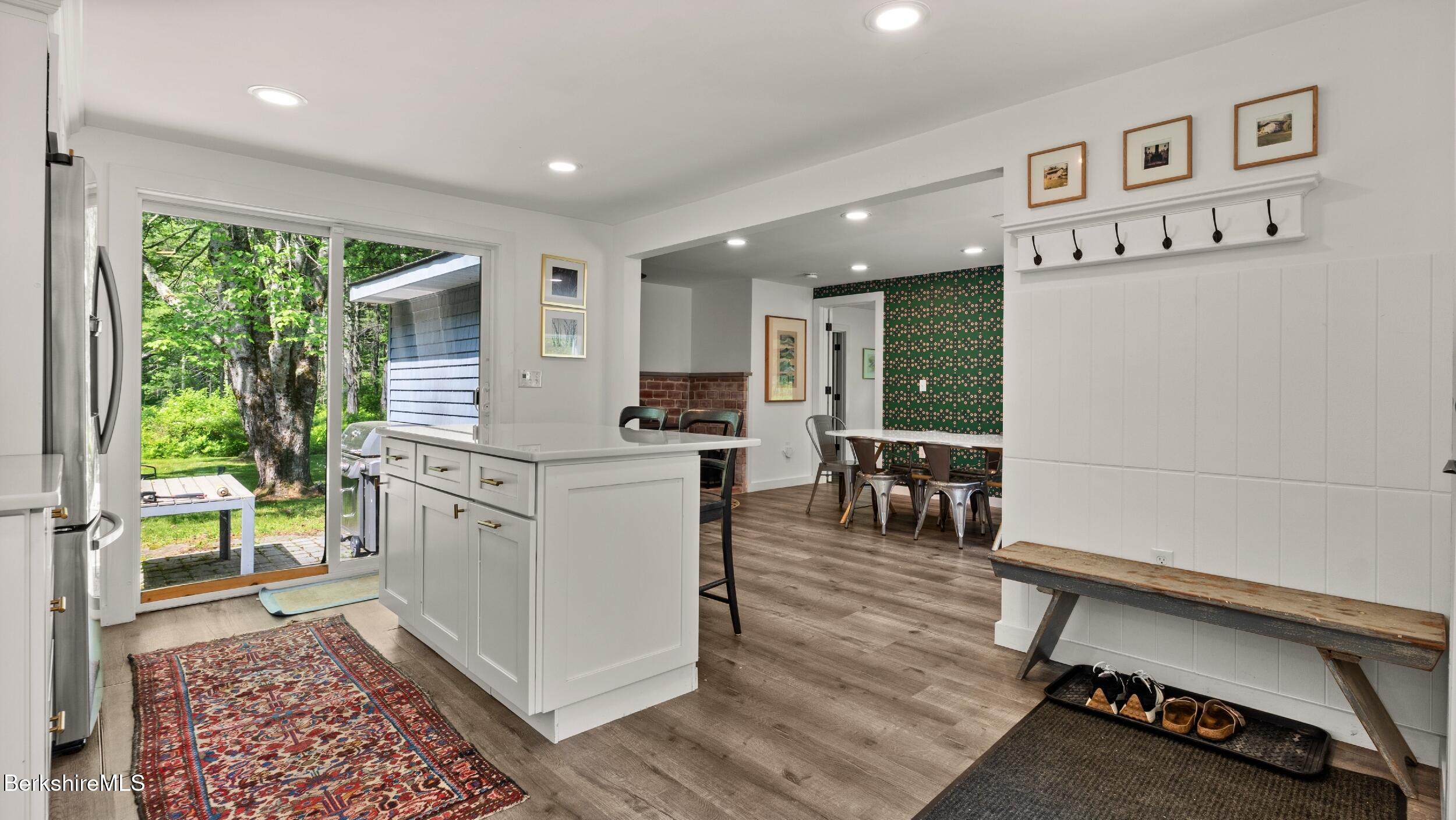 418 Monterey Road Great Barrington, MA 01230 - Photo 10 of 28 a kitchen with a refrigerator and a table