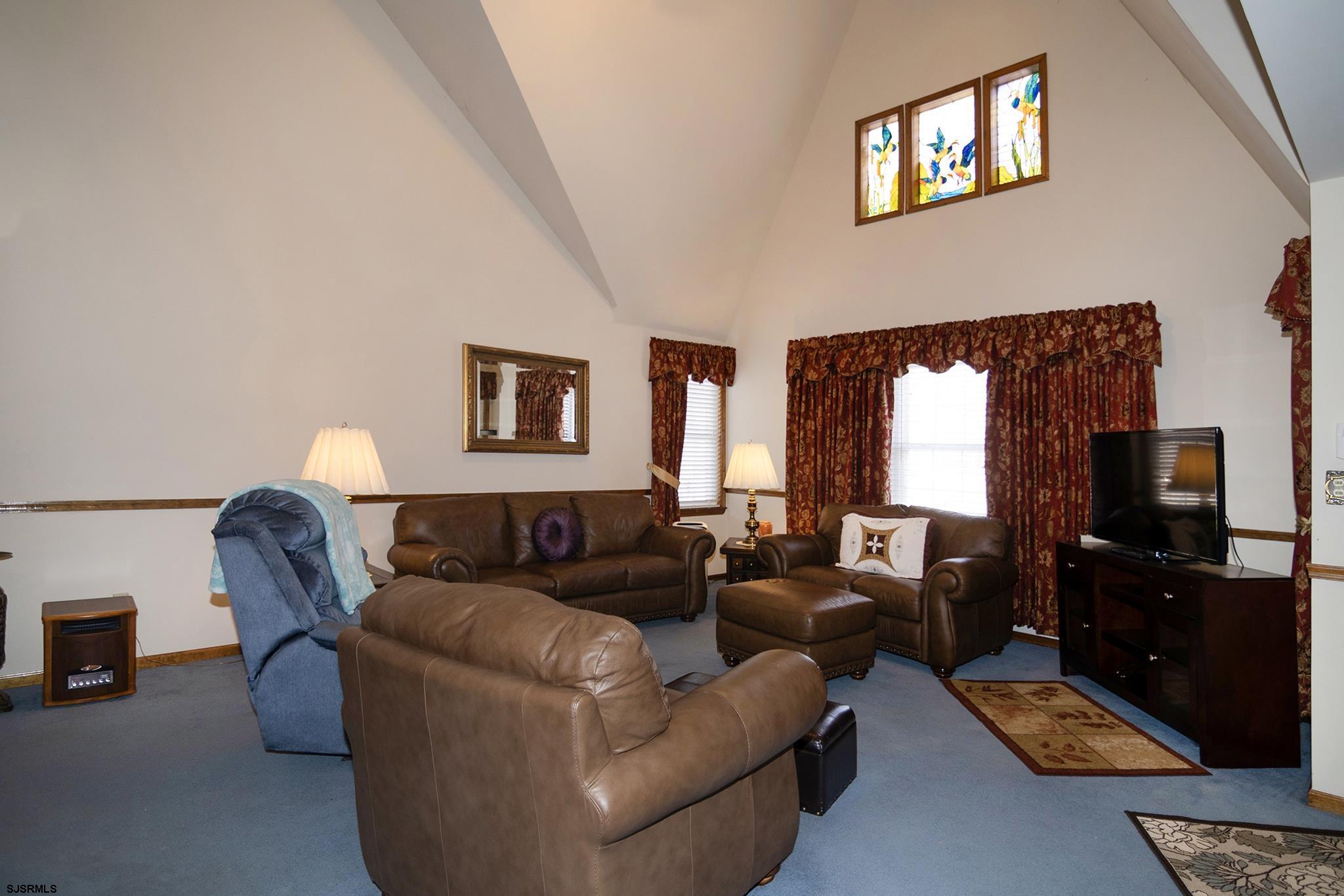 55 Taylor Avenue Milmay, NJ 08340 - Photo 11 of 53 a living room with furniture and a flat screen tv