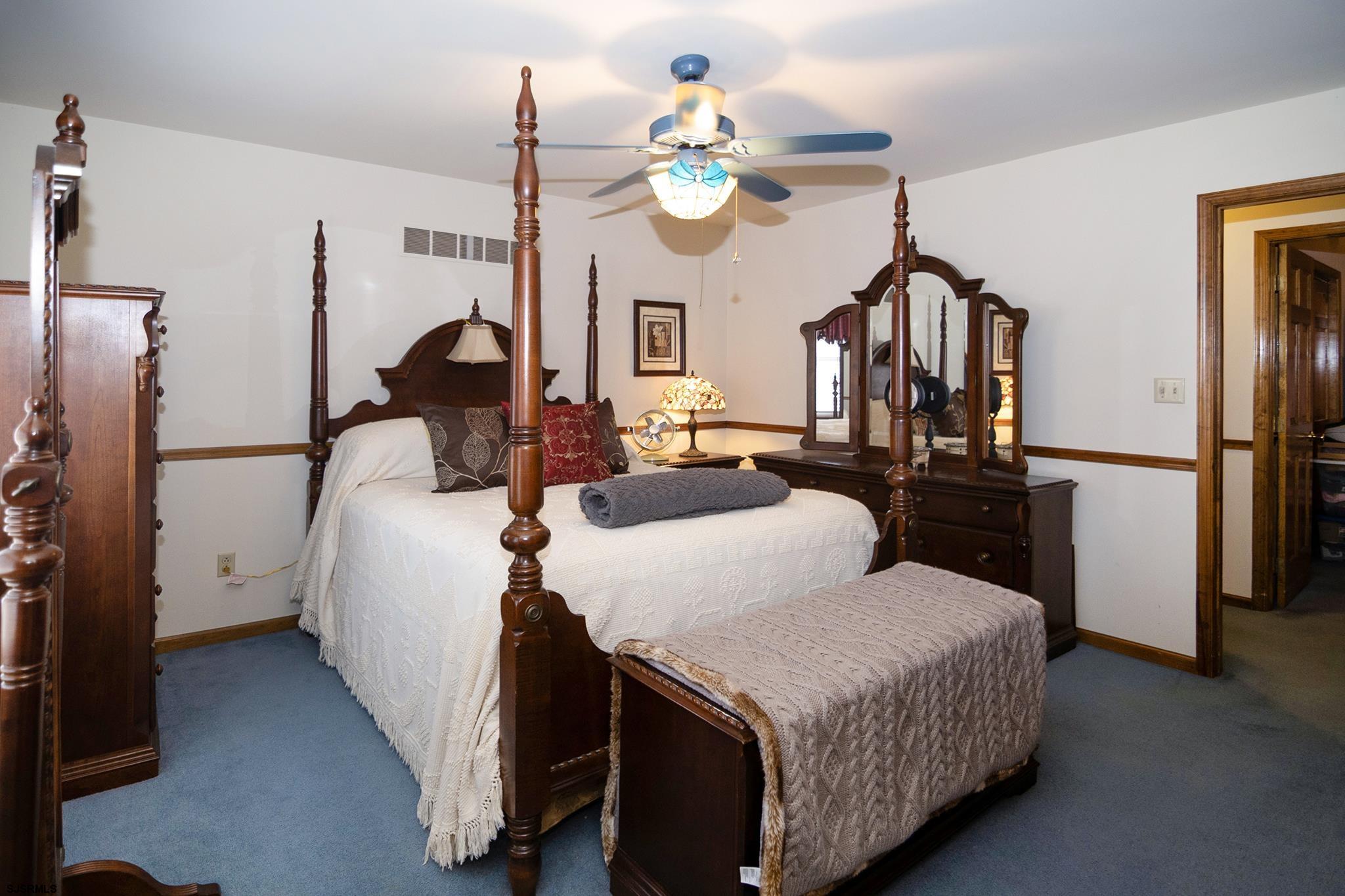 55 Taylor Avenue Milmay, NJ 08340 - Photo 26 of 53 a bedroom with bed and a chandelier