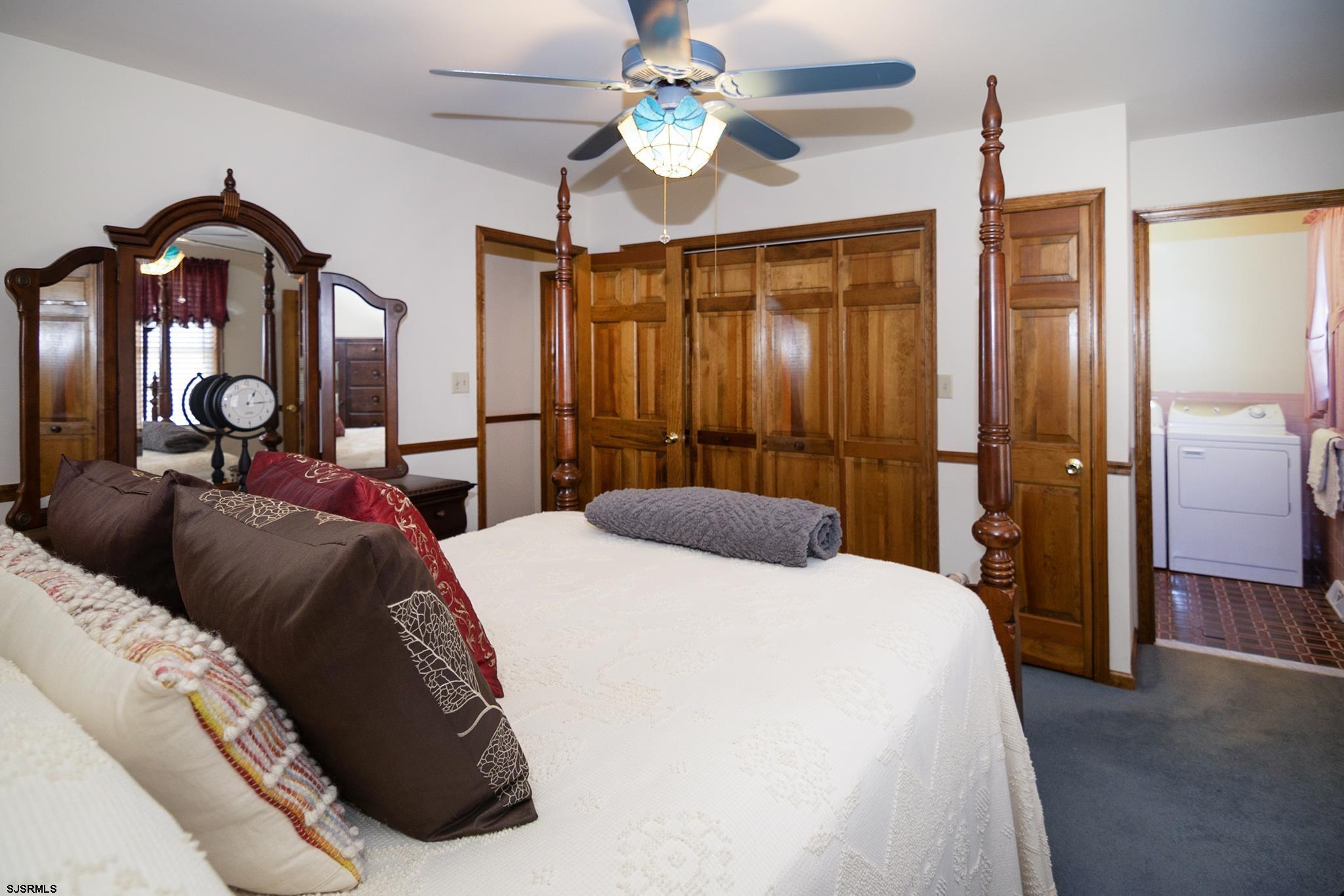 55 Taylor Avenue Milmay, NJ 08340 - Photo 27 of 53 a bedroom with a bed and wooden floor