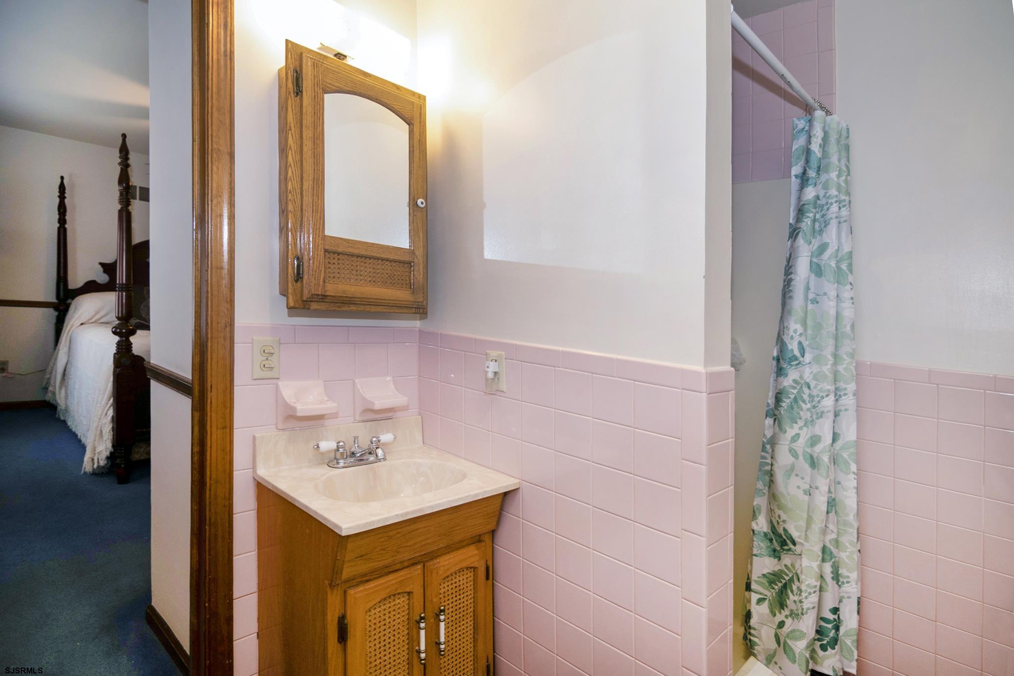 55 Taylor Avenue Milmay, NJ 08340 - Photo 29 of 53 a bathroom with a sink and a mirror