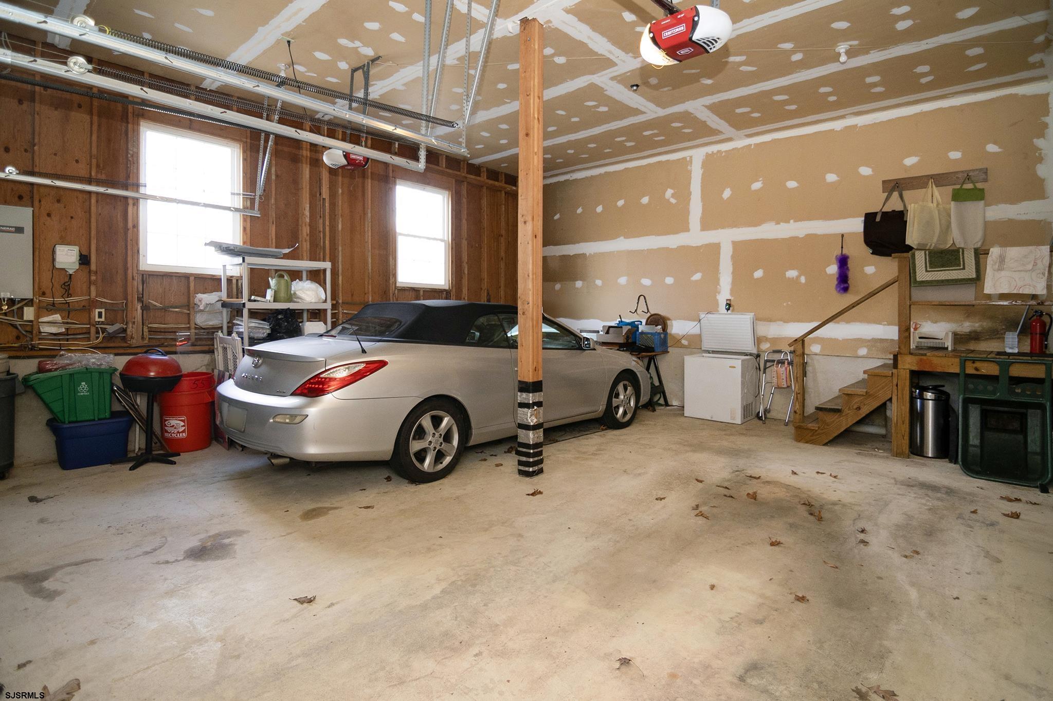 55 Taylor Avenue Milmay, NJ 08340 - Photo 45 of 53 a view of a garage with cars parked
