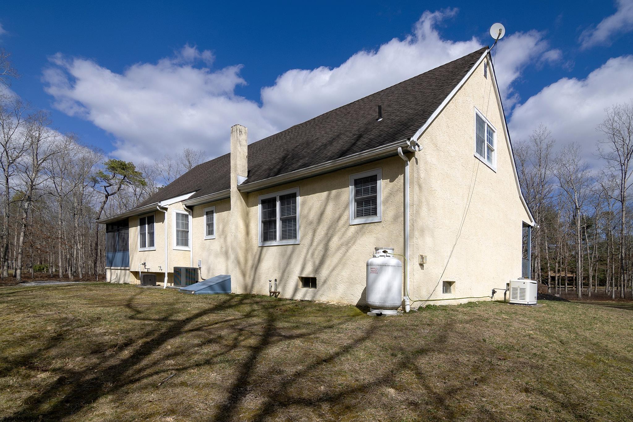 55 Taylor Avenue Milmay, NJ 08340 - Photo 48 of 53 a view of a white house with a yard