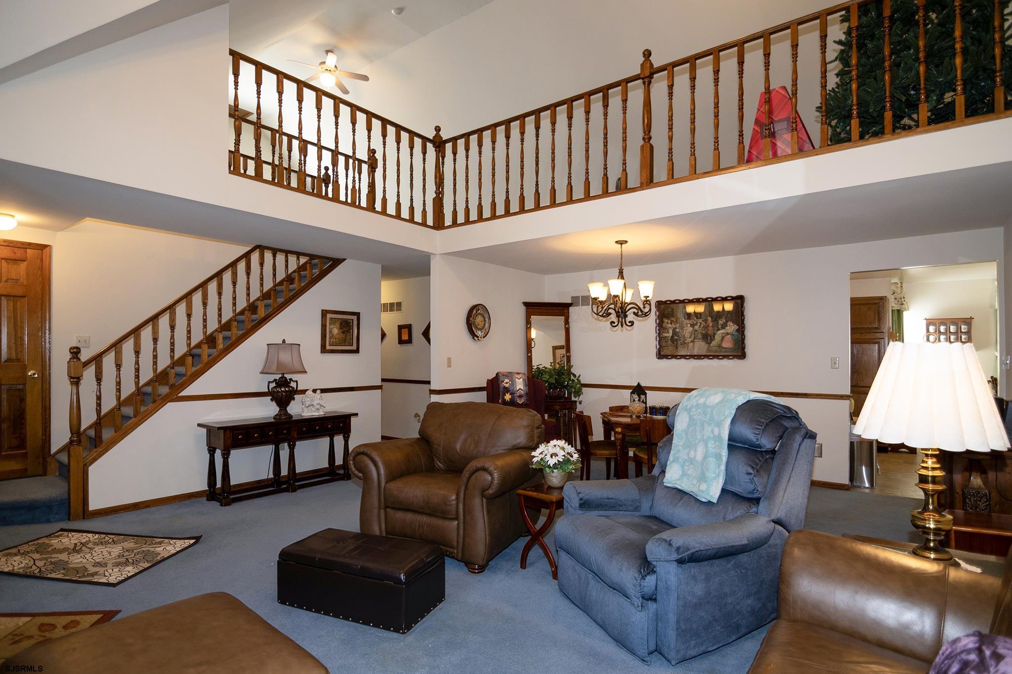 55 Taylor Avenue Milmay, NJ 08340 - Photo 7 of 53 a living room with furniture ceiling fan and a rug