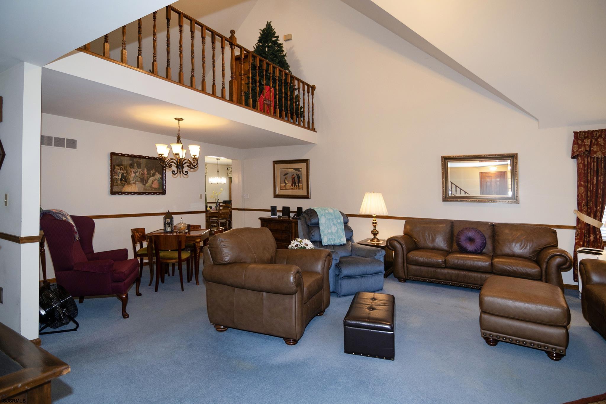 55 Taylor Avenue Milmay, NJ 08340 - Photo 8 of 53 a living room with furniture a flat screen tv and a couch