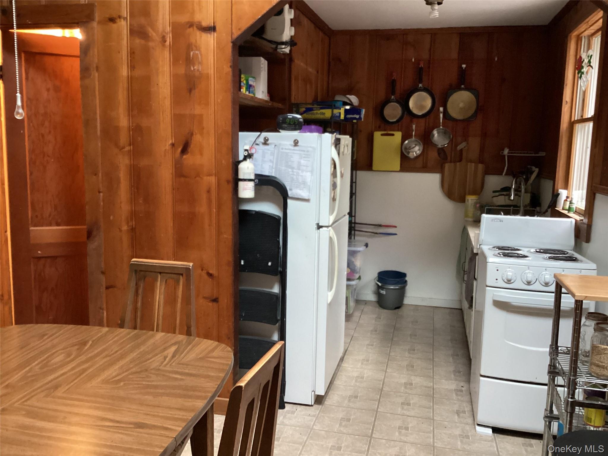 302 Todd Road, Unit T Woodbourne, NY 12788 - Photo 9 of 14 a bed room with a bed and a tv