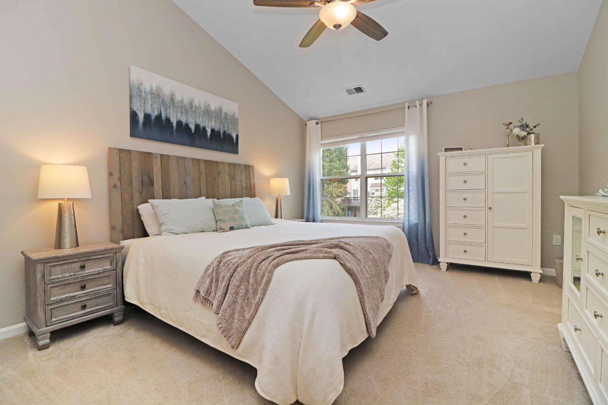 47640 Comer Square Sterling, VA 20165 - Photo 20 of 58 a bedroom with a bed and a chandelier