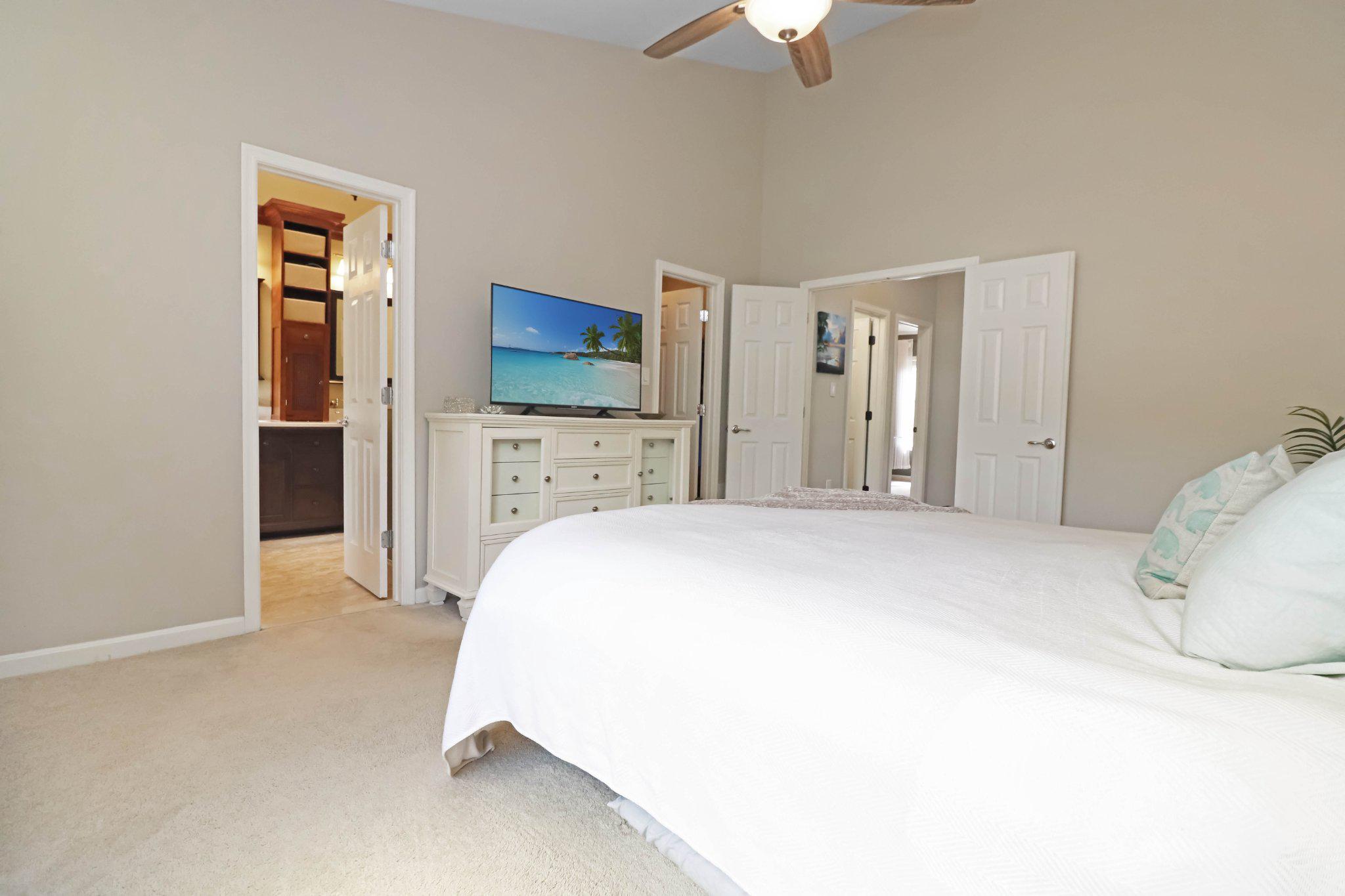 47640 Comer Square Sterling, VA 20165 - Photo 22 of 58 a spacious bedroom with a bed and a flat screen tv