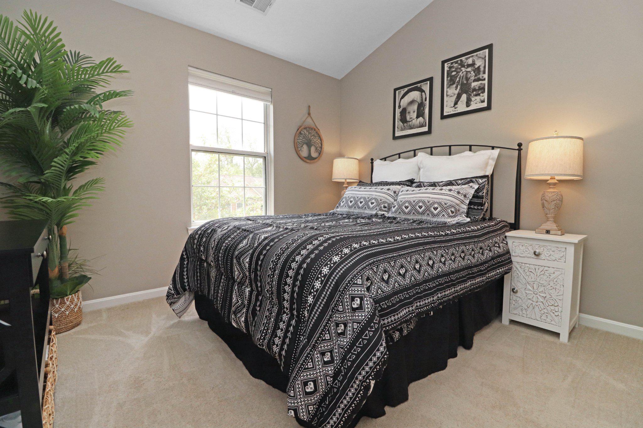 47640 Comer Square Sterling, VA 20165 - Photo 26 of 58 a bedroom with a bed and a potted plant