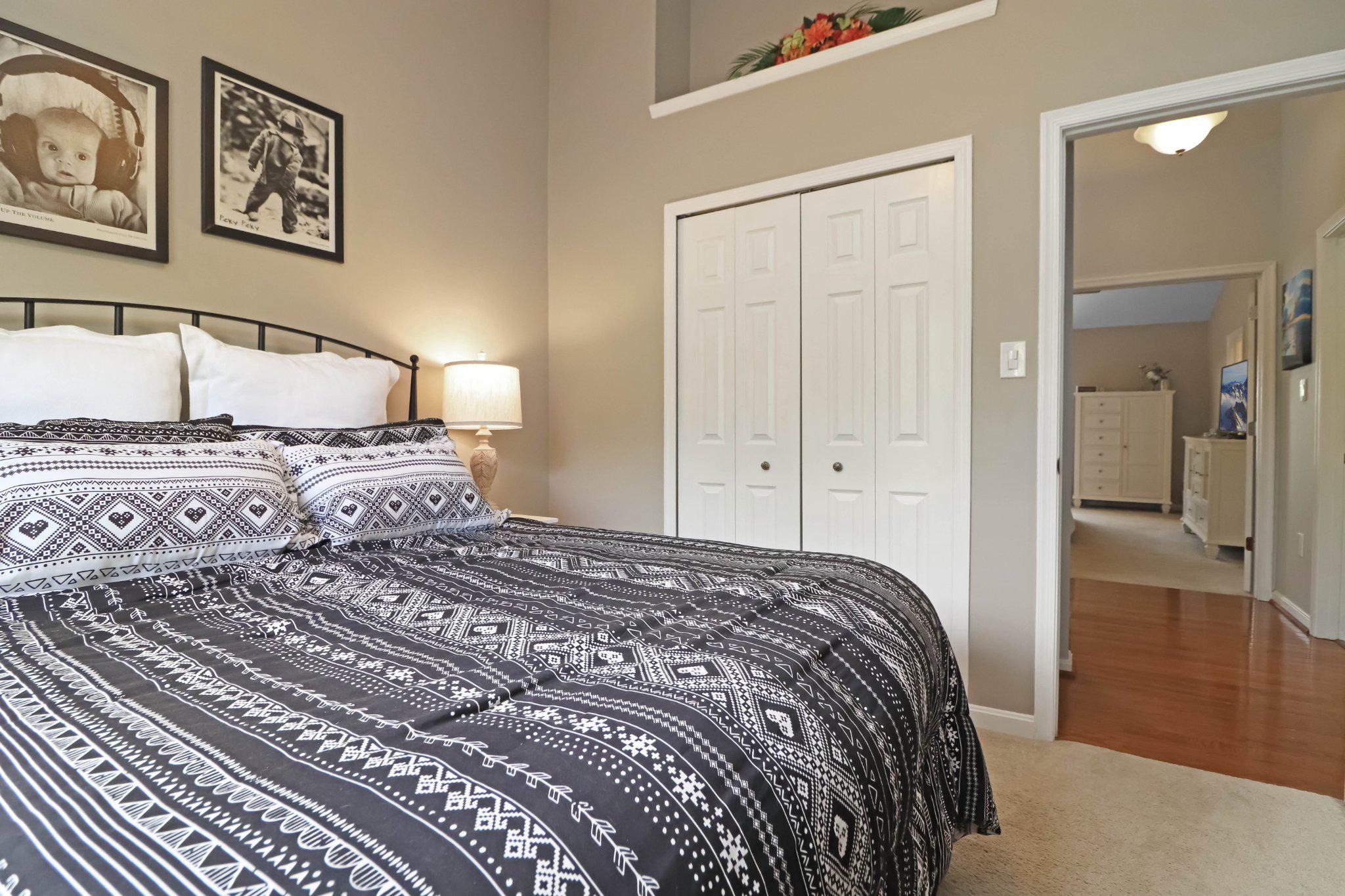 47640 Comer Square Sterling, VA 20165 - Photo 27 of 58 a bedroom with a bed and painting on the wall