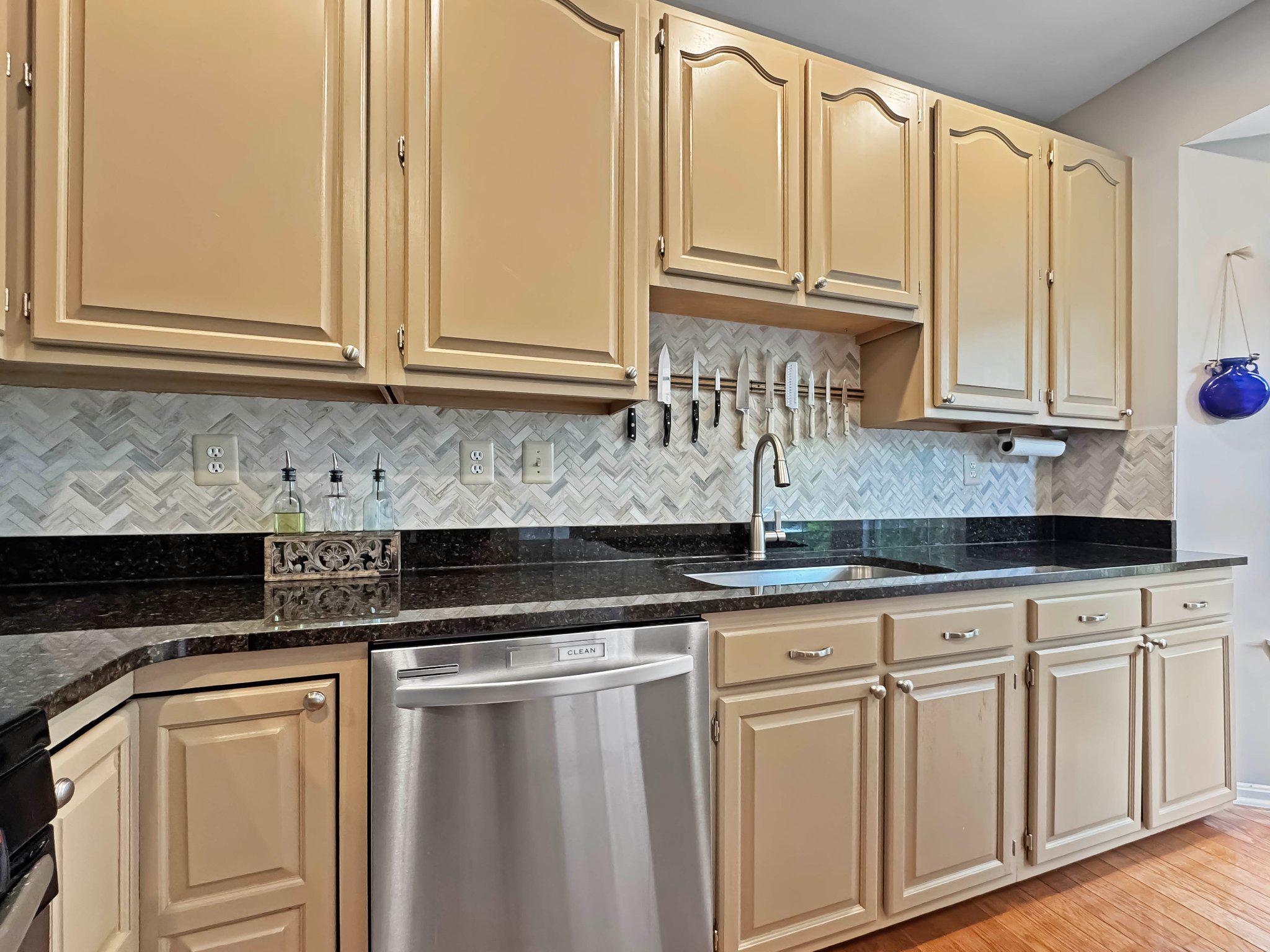 47640 Comer Square Sterling, VA 20165 - Photo 10 of 58 a kitchen with stainless steel appliances granite countertop a sink and cabinets