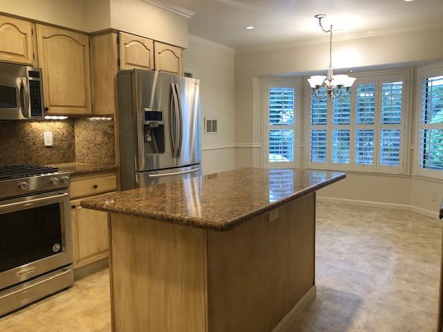 121 Soledad Drive Monterey, CA 93940 - Photo 7 of 14 a kitchen with stainless steel appliances granite countertop a sink a stove and a refrigerator
