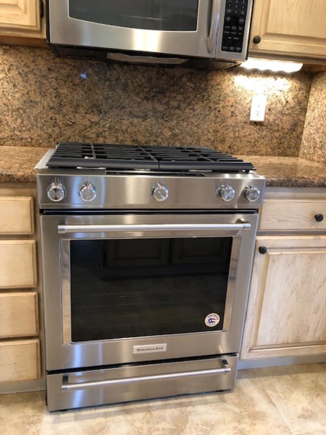 121 Soledad Drive Monterey, CA 93940 - Photo 8 of 14 a stove top oven sitting inside of a kitchen