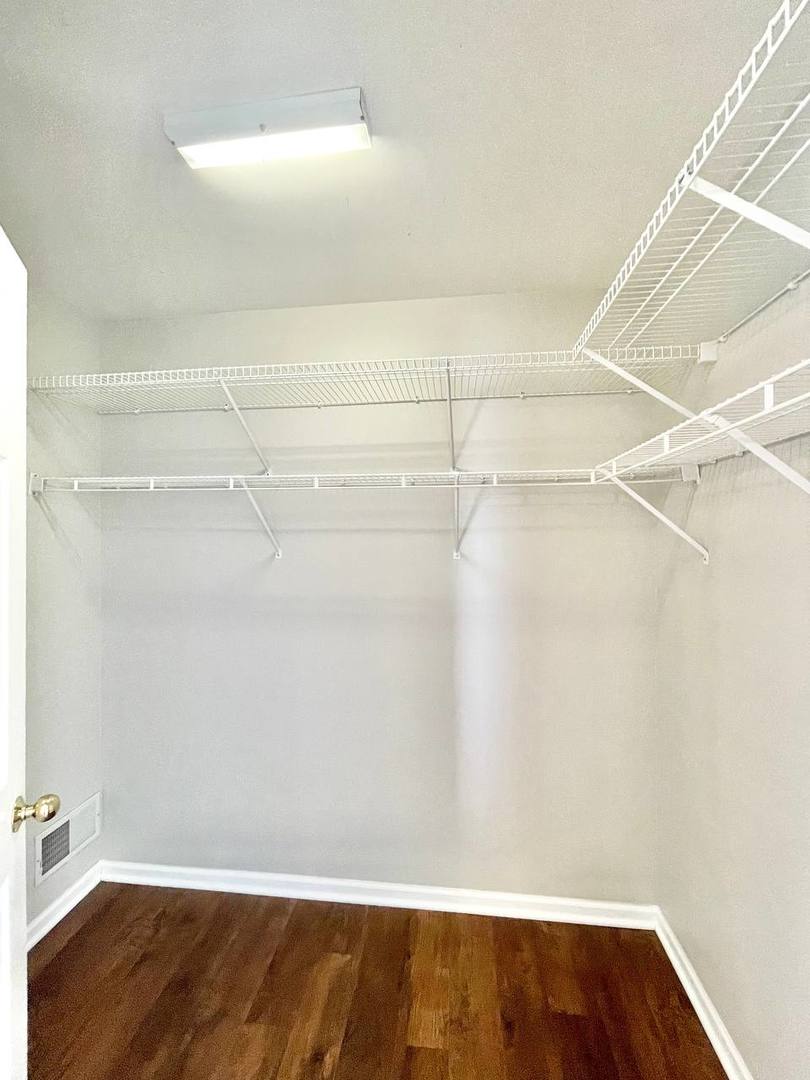 602 Pearces Ford Road Oswego, IL 60543 - Photo 20 of 40 a view of a room with wooden floor