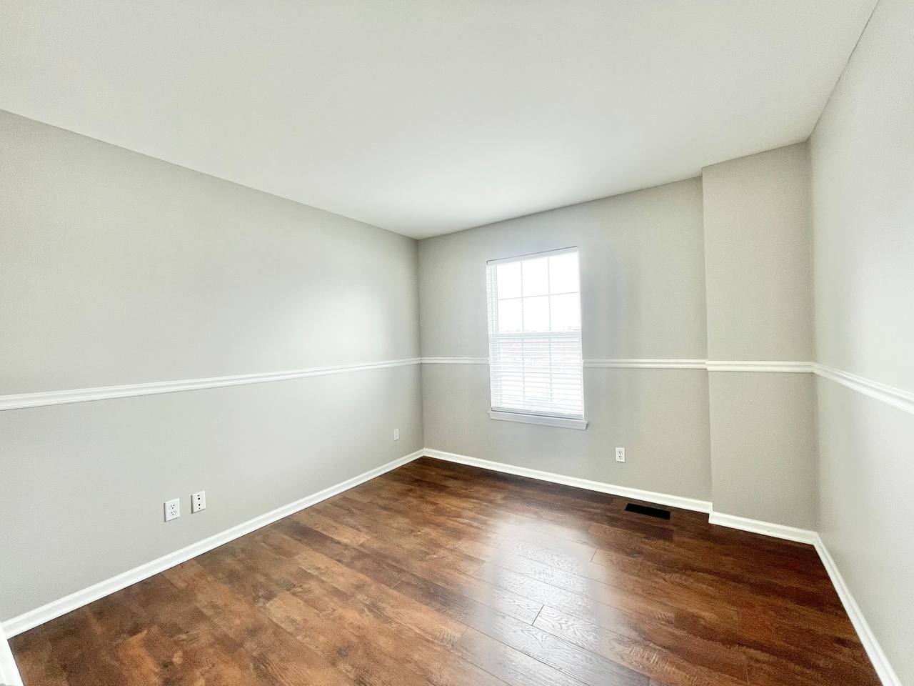 602 Pearces Ford Road Oswego, IL 60543 - Photo 21 of 40 an empty room with wooden floor and windows