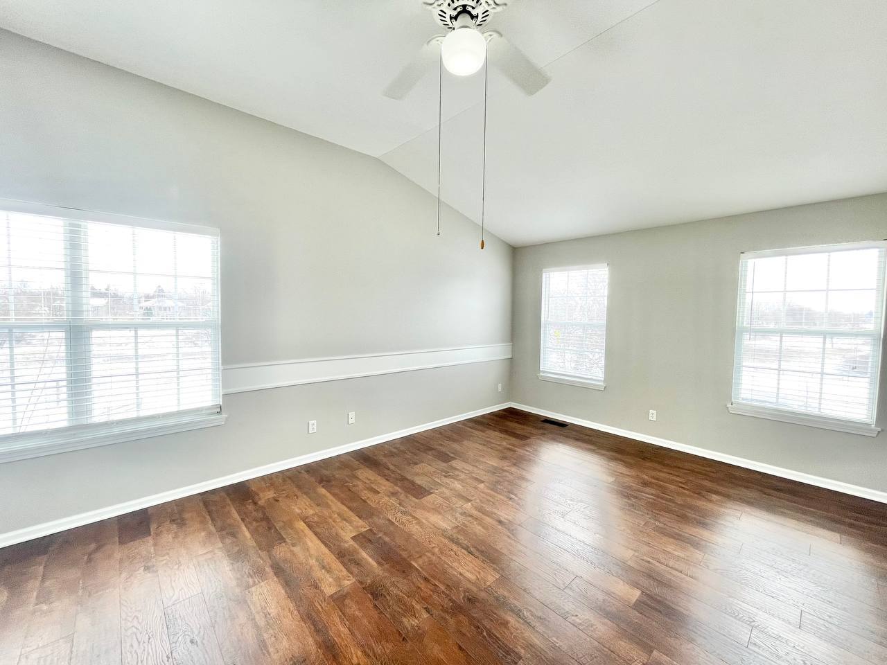 602 Pearces Ford Road Oswego, IL 60543 - Photo 22 of 40 an empty room with wooden floor and windows