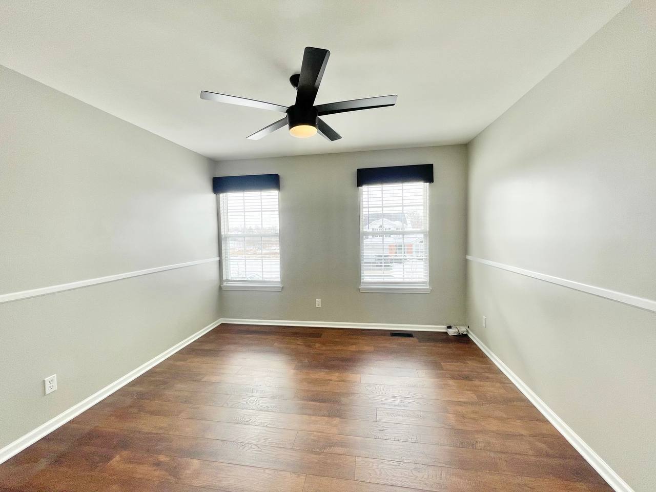 602 Pearces Ford Road Oswego, IL 60543 - Photo 25 of 40 an empty room with wooden floor and windows