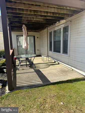 a view of a backyard with sitting area