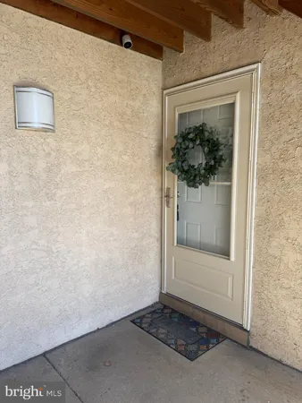 a view of a door and chair in a room