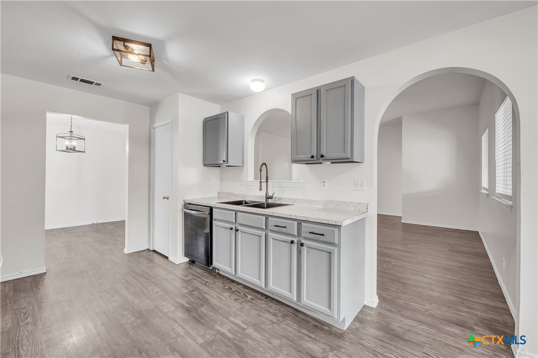 2903 Blue Ridge Drive Killeen, TX 76543 - Photo 14 of 32 a kitchen with stainless steel appliances granite countertop a sink stove and refrigerator