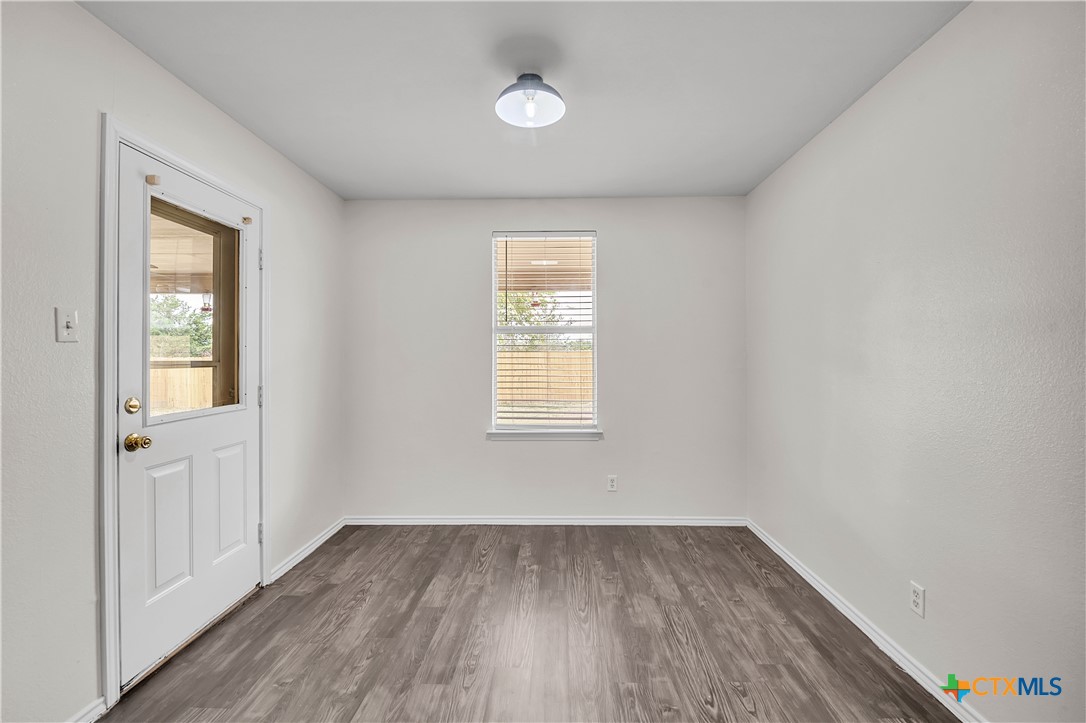 2903 Blue Ridge Drive Killeen, TX 76543 - Photo 15 of 32 an empty room with wooden floor and windows