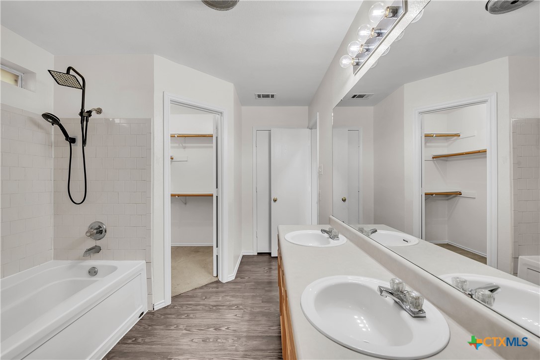 2903 Blue Ridge Drive Killeen, TX 76543 - Photo 20 of 32 a bathroom with a tub sink and mirror