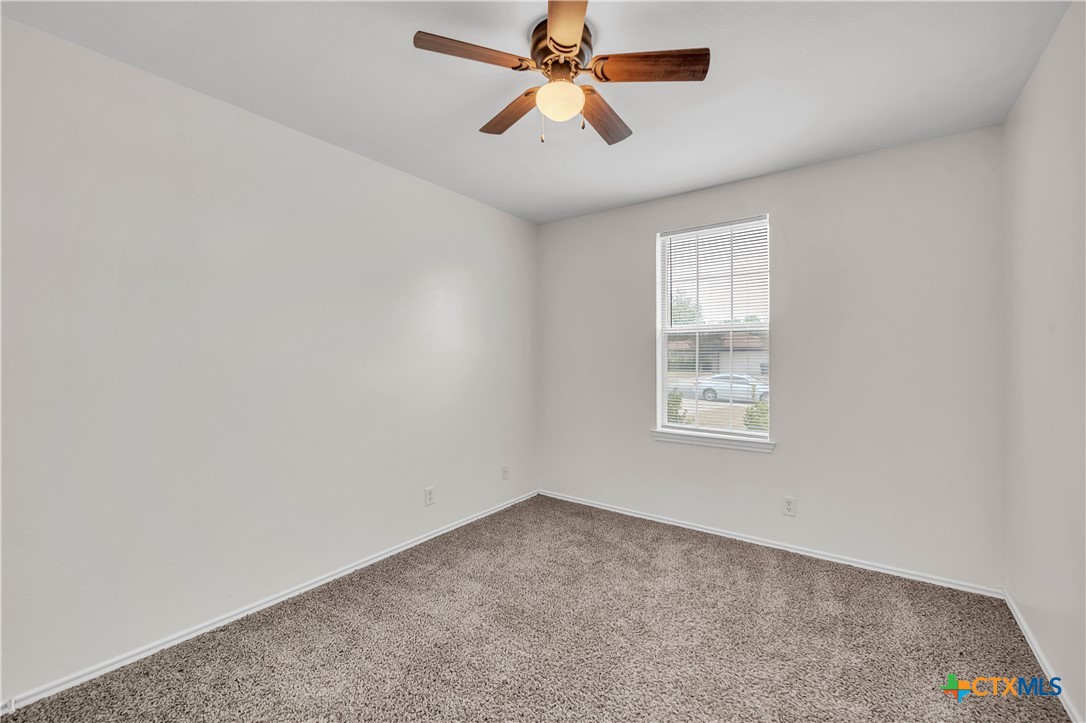 2903 Blue Ridge Drive Killeen, TX 76543 - Photo 22 of 32 an empty room with windows and fan