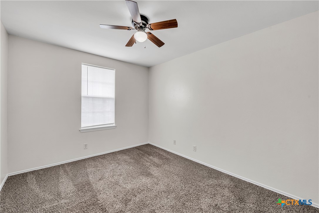 2903 Blue Ridge Drive Killeen, TX 76543 - Photo 24 of 32 an empty room with a window and a fan