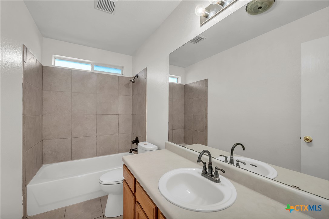2903 Blue Ridge Drive Killeen, TX 76543 - Photo 26 of 32 a bathroom with a sink a toilet and shower