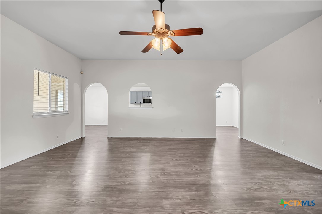 2903 Blue Ridge Drive Killeen, TX 76543 - Photo 5 of 32 a view of an empty room with wooden floor and a window