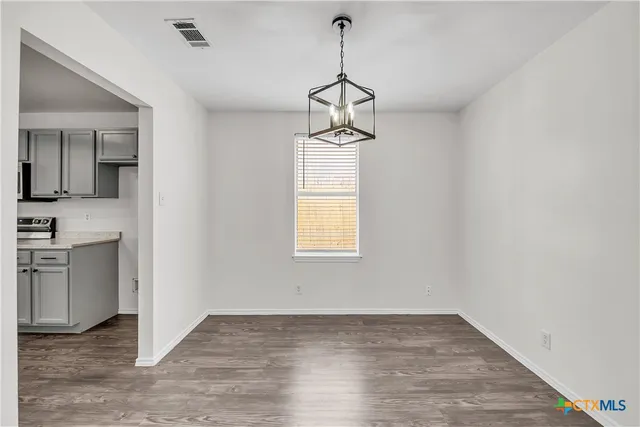 a view of a kitchen with a sink and dishwasher a window