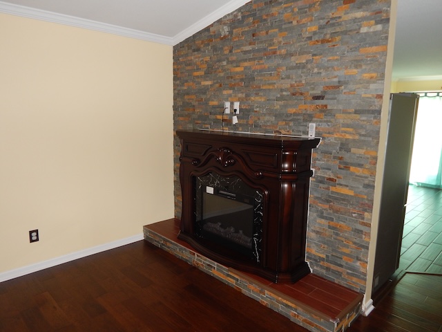 855 Louie Lane Seneca, SC 29678 - Photo 11 of 33 This inviting space features rich hardwood floors and a striking stone accent wall.