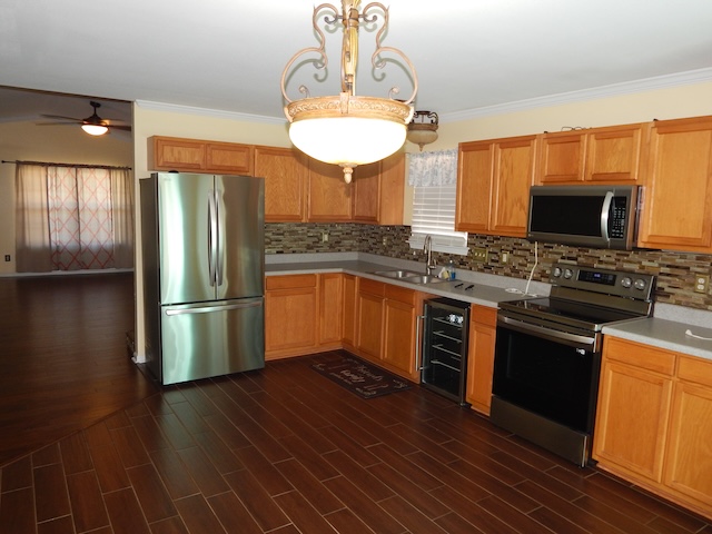 855 Louie Lane Seneca, SC 29678 - Photo 13 of 33 This modern kitchen features rich wood floors, ample cabinetry, and sleek stainless steel appliances.