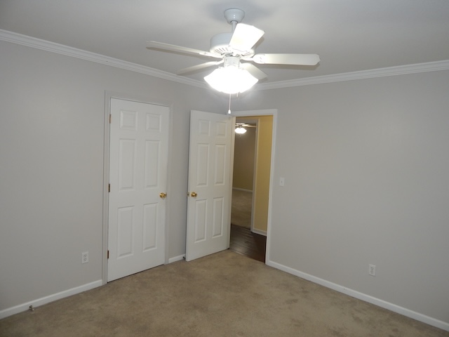 855 Louie Lane Seneca, SC 29678 - Photo 19 of 33 This cozy bedroom offers a tranquil retreat with soft carpet flooring and a ceiling fan.
