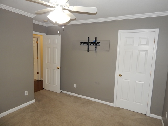 855 Louie Lane Seneca, SC 29678 - Photo 20 of 33 This spacious bedroom offers comfortable carpeting and a ceiling fan, creating an inviting atmosphere.