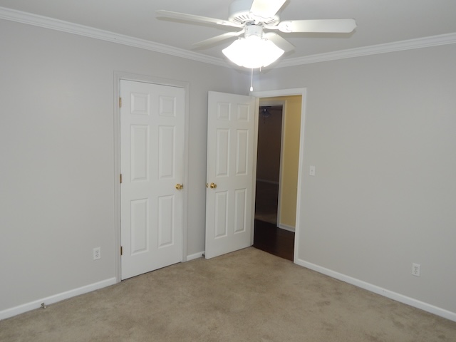 855 Louie Lane Seneca, SC 29678 - Photo 23 of 33 This spacious bedroom offers comfortable living with ample light and classic architectural details.