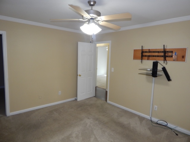 855 Louie Lane Seneca, SC 29678 - Photo 28 of 33 This cozy bedroom features comfortable carpeting, a ceiling fan, and crown molding.