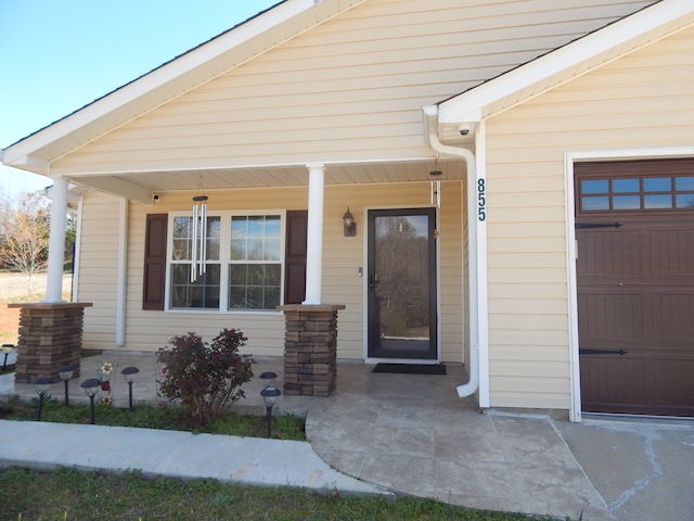 855 Louie Lane Seneca, SC 29678 - Photo 3 of 33 This inviting home features a charming covered porch and an attached garage.