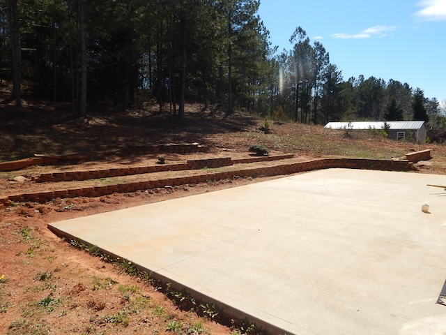 855 Louie Lane Seneca, SC 29678 - Photo 7 of 33 This spacious concrete pad offers an ideal foundation for outdoor living amidst natural surroundings.