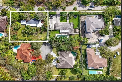 an aerial view of a house with a garden