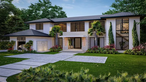 a front view of a house with a yard and green space