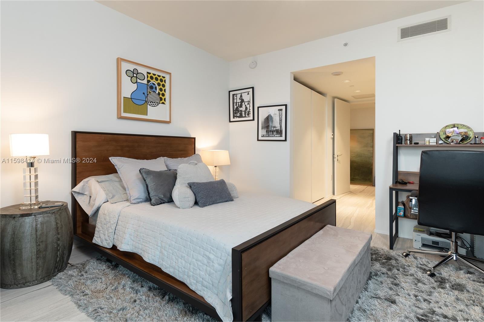 1000 Biscayne Boulevard, Unit TH1002 Miami, FL 33132 - Photo 27 of 27 a bedroom with a bed and a flat screen tv