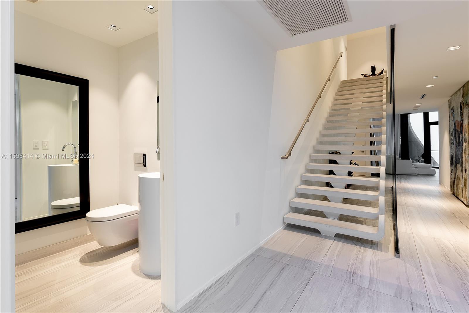 1000 Biscayne Boulevard, Unit TH1002 Miami, FL 33132 - Photo 9 of 27 a view of a hallway with wooden floor and entryway